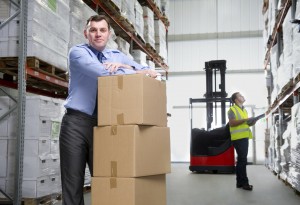 Man in warehouse with boxes