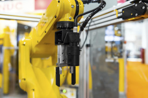 Robot arm in a factory working for the humans