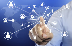 Modern business concept image of a Businessman clicking people connection icon on blue background