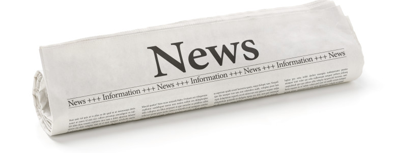 Rolled newspaper with the headline News